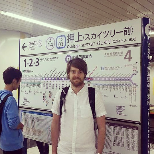 David waiting for the train to arrive at a Metro station in Tokyo