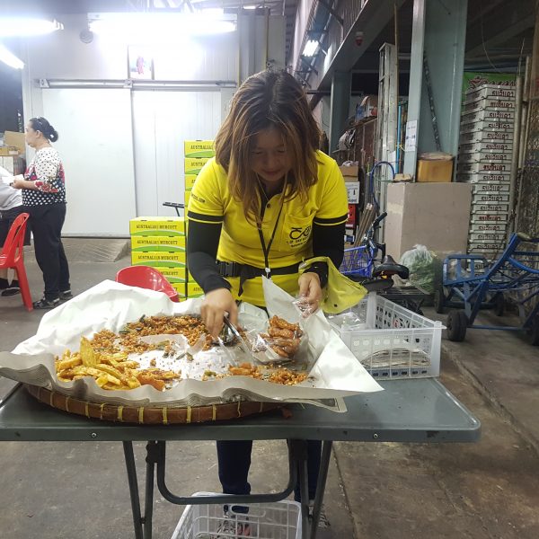 Sandra picking fried banana and sweet potato